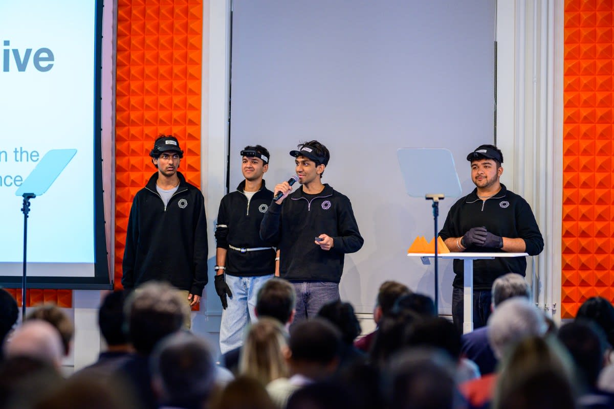Gig worker wearing camera-equipped cap while performing everyday tasks for AI training data collection