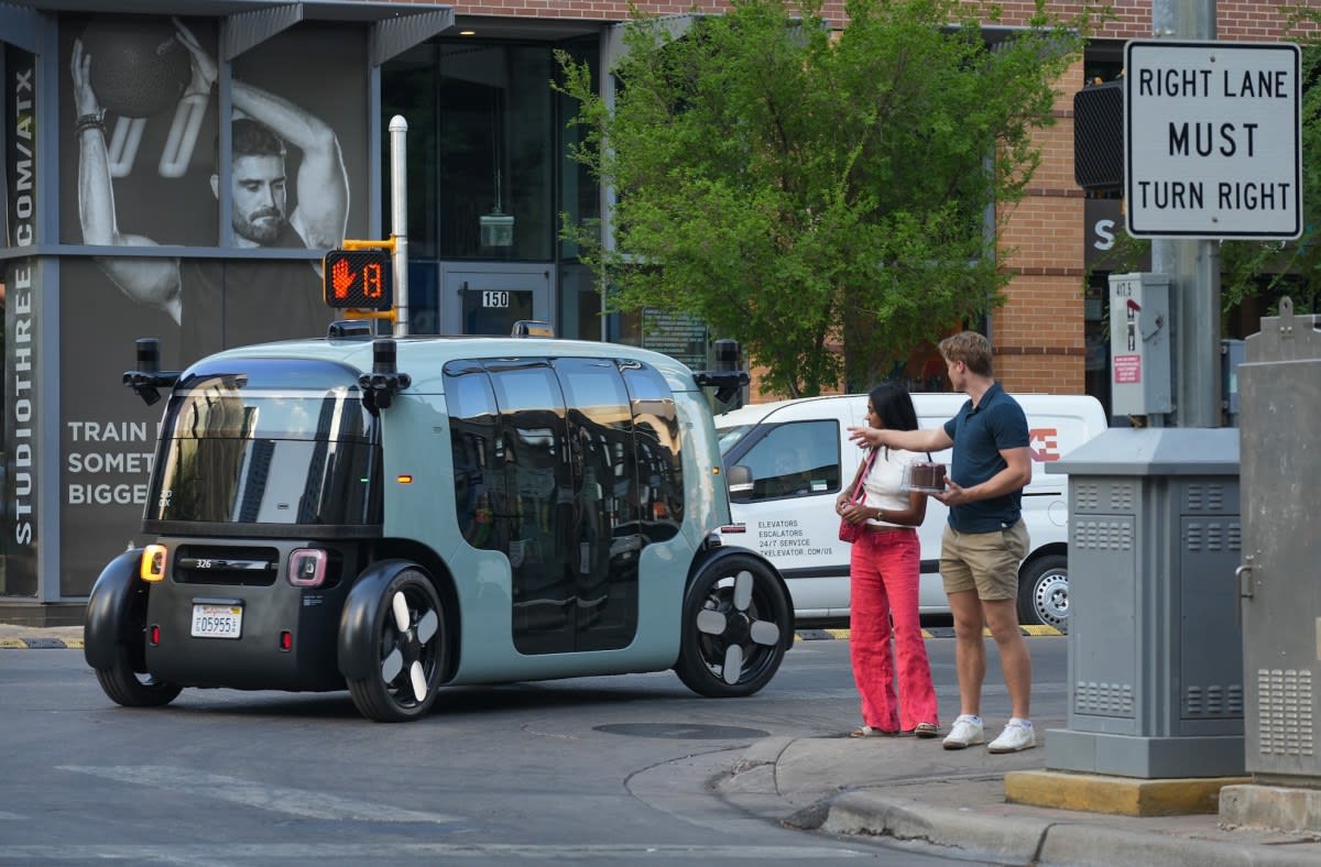 Zoox autonomous robotaxi vehicle without steering wheel or pedals on city street