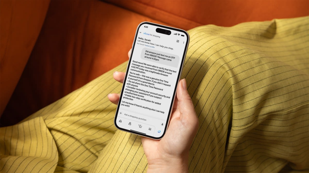 Person using smartphone to check Amazon messages with AI assistance for scam verification