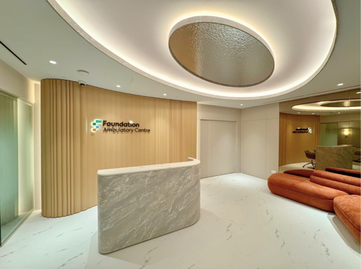 Healthcare professionals collaborating with digital technology platform connecting multiple medical facilities in Singapore