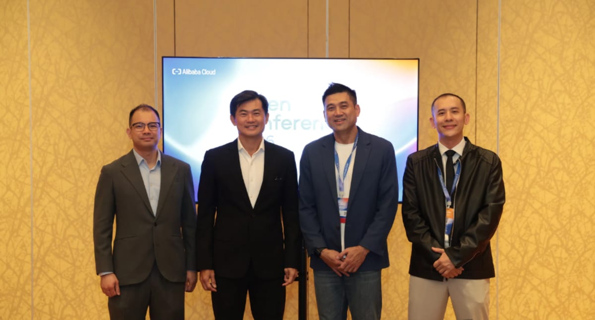 Diverse group of Singapore workers learning AI technology together in modern training facility