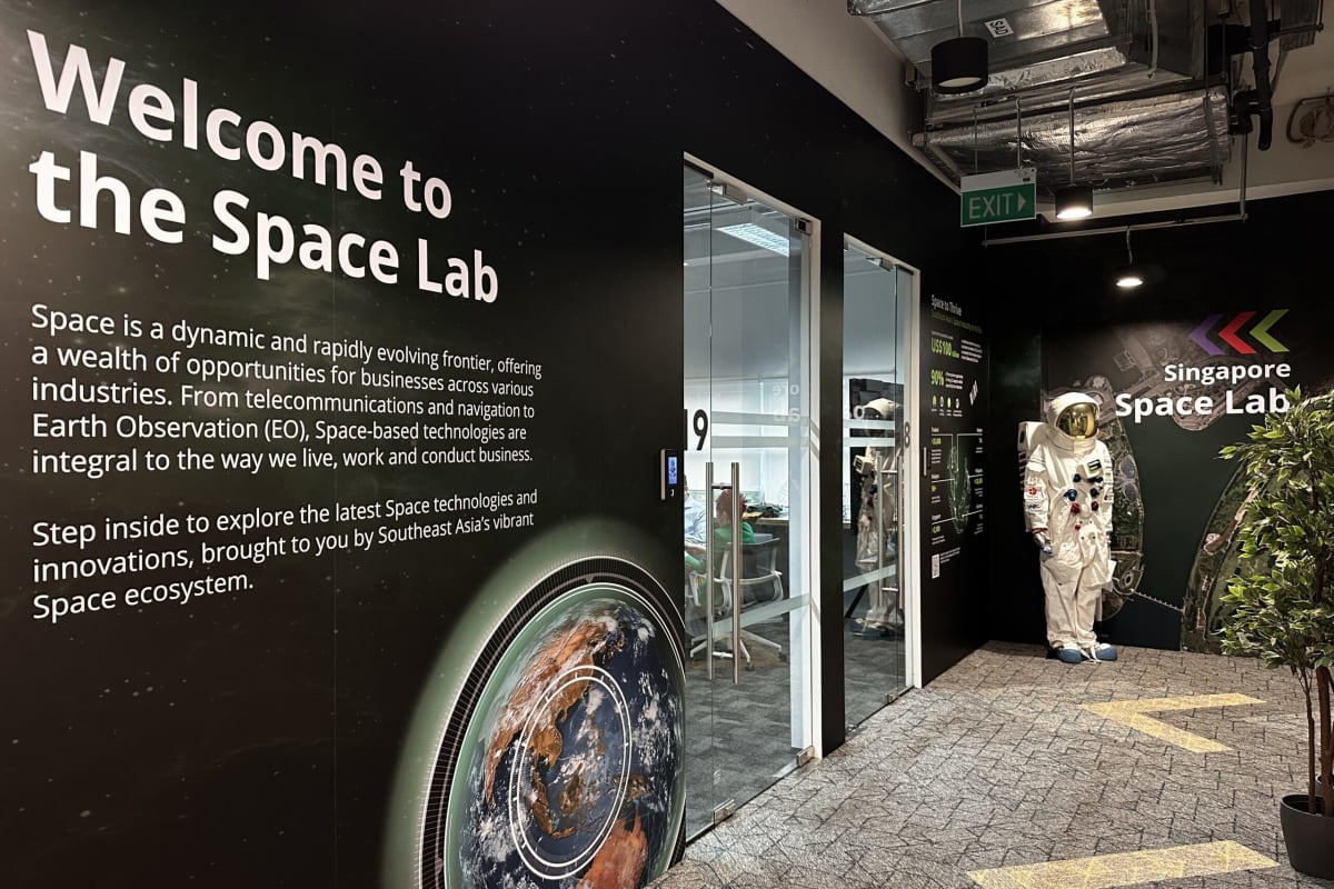 Modern space innovation laboratory facility in Singapore with satellite technology displays and collaborative workspaces