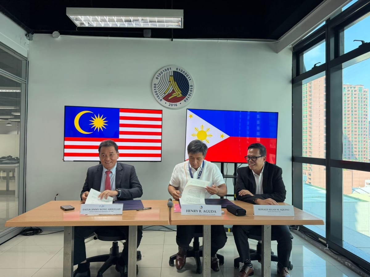 Digital network connecting Malaysia and Philippines flags symbolizing blockchain infrastructure partnership across Southeast Asia