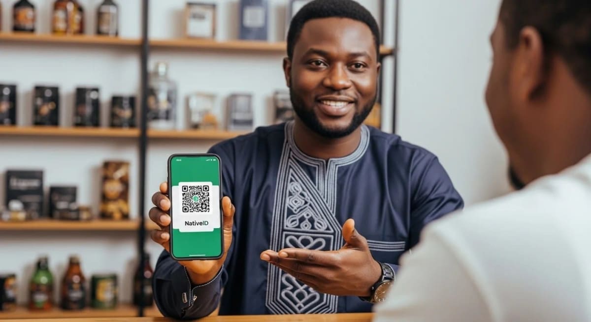 Nigerian entrepreneur scanning QR code to access verified business digital identity page