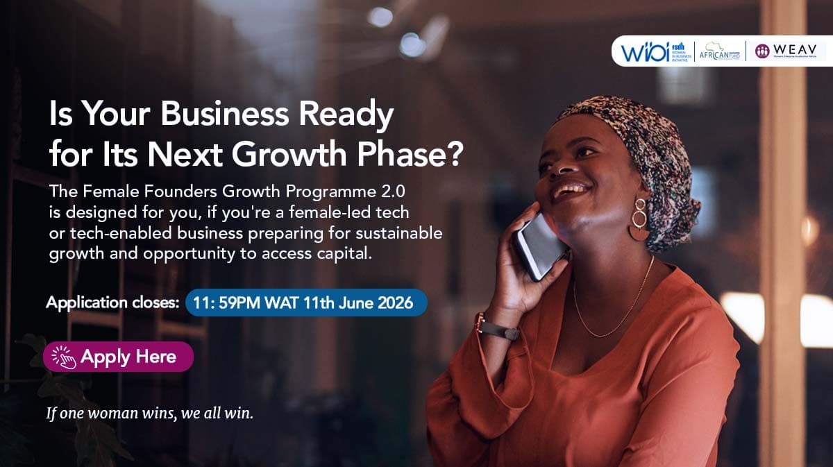 Female entrepreneurs collaborating in modern Nigerian business workspace with laptops and documents
