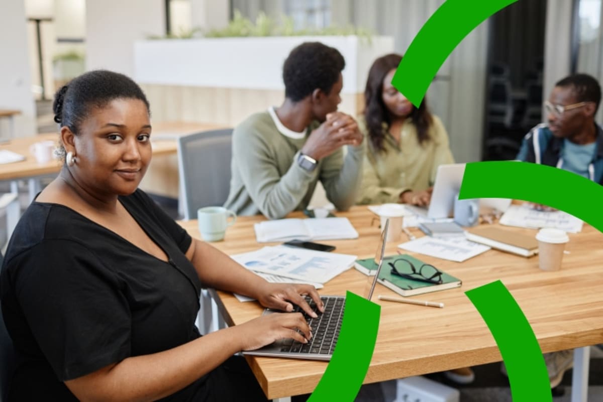 Nigerian entrepreneurs collaborating in modern workspace during startup training program session