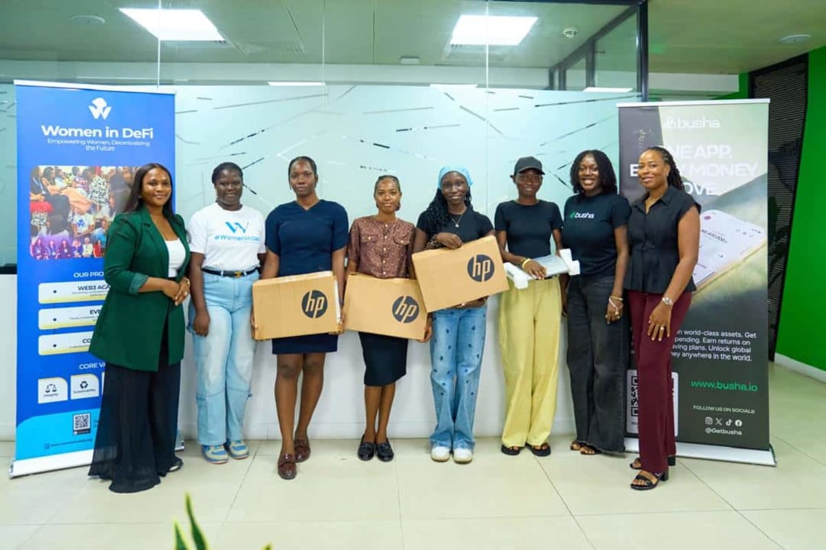 Young African women receiving laptops at technology summit in Lagos Nigeria