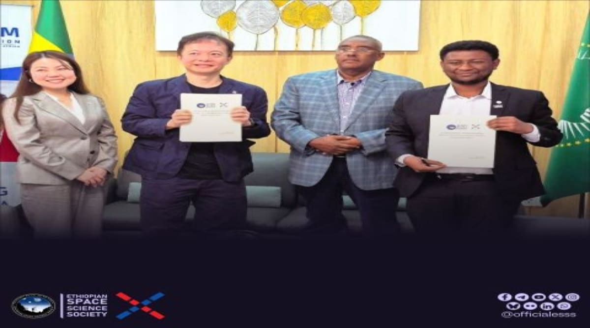 Ethiopian and Japanese space officials shaking hands after signing collaborative space technology agreement