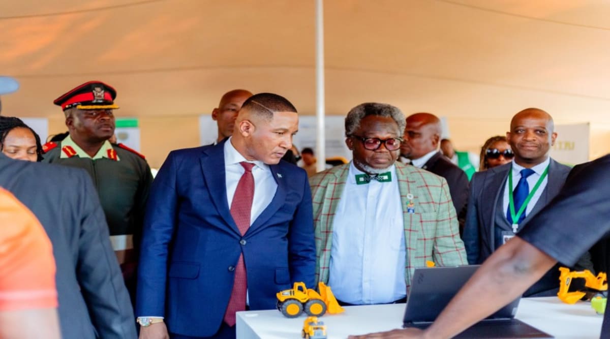 Technology innovators presenting digital solutions at exhibition booth in Botswana industrial expo