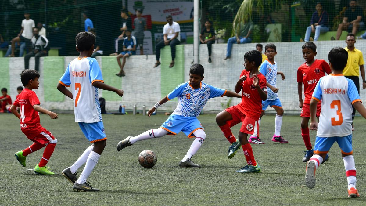 Young female football players training at academy in Bengaluru, India