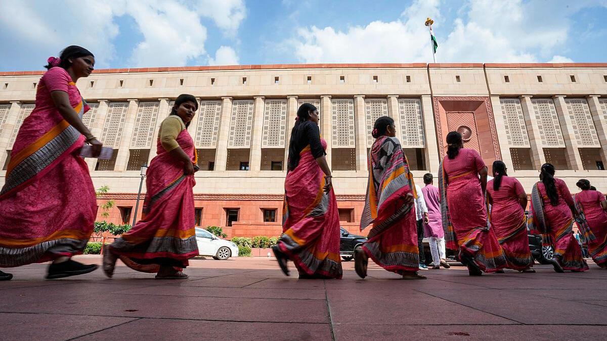 Women voters and political leaders in India celebrating expanded representation in Parliament