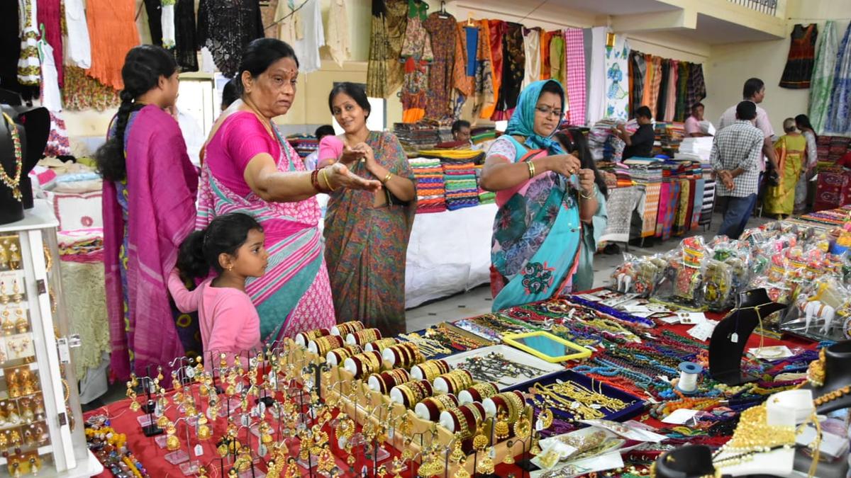 Colorful traditional Indian handloom textiles and handicrafts displayed in government showroom