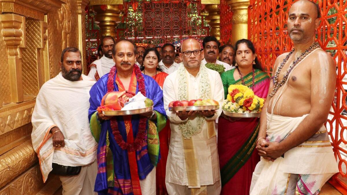 Devotees gather at ornate Hindu temple during Hanuman Jayanthi religious celebration in Tirumala, India