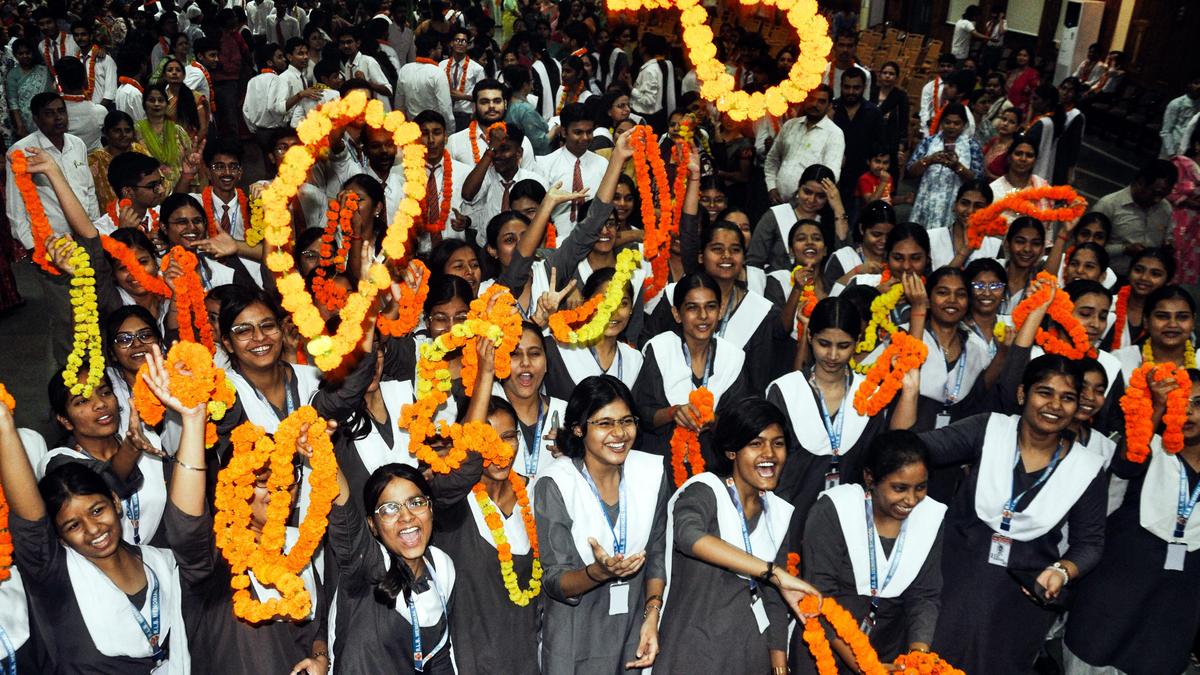 Indian Class 12 students celebrating exam results with families after successful re-evaluation process