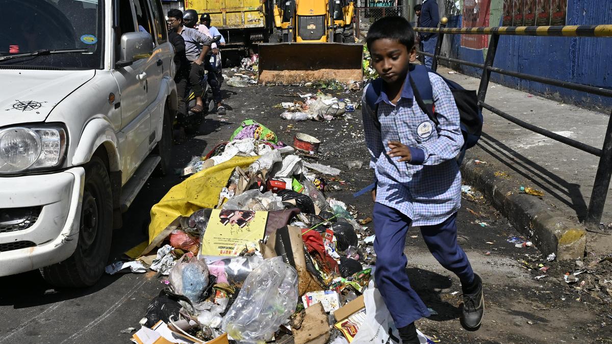 Modern electric waste collection vehicle with GPS tracking system in Bengaluru, India