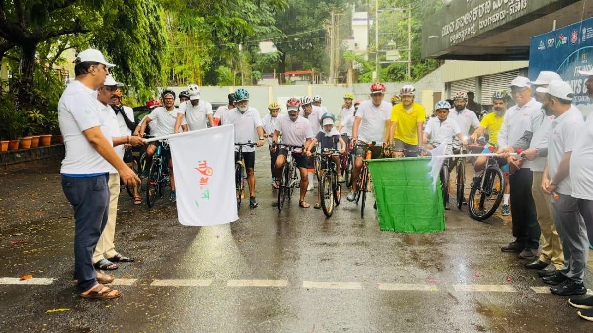 Cyclists riding together through Mangaluru streets during World Bicycle Day rally celebration