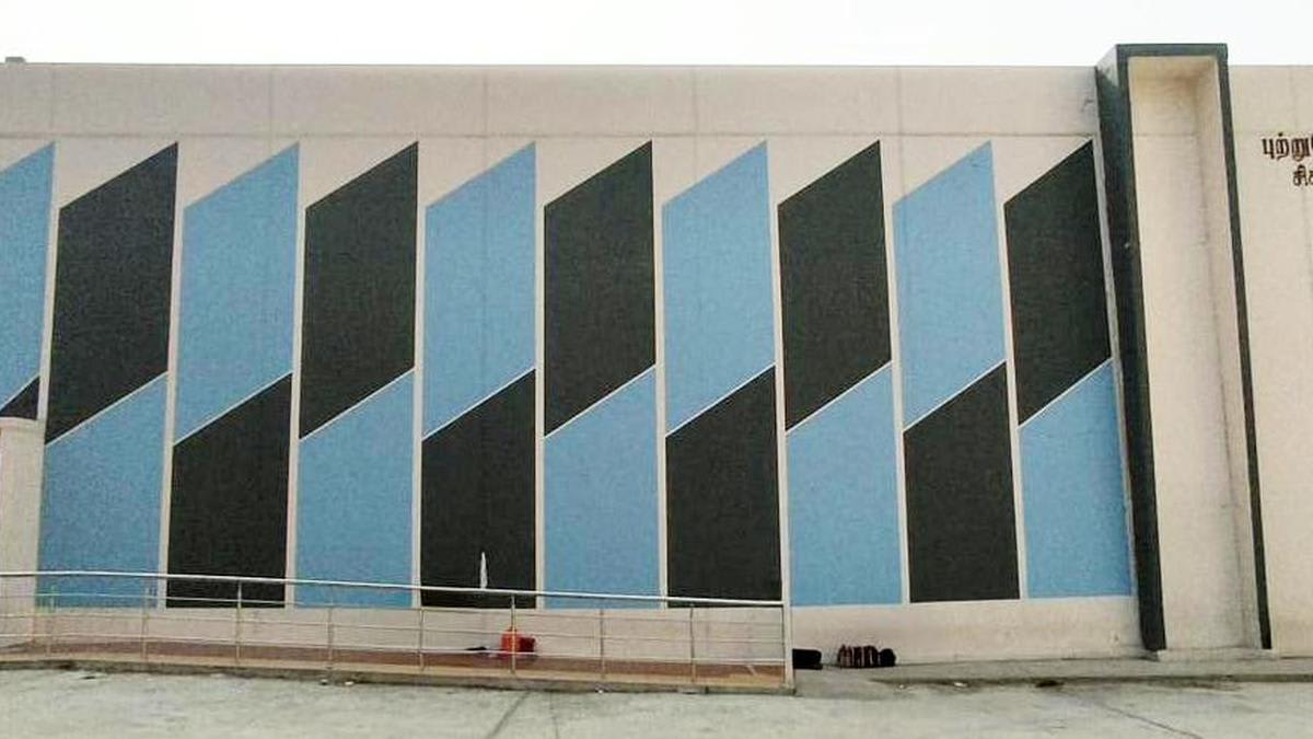 Modern hospital cancer treatment facility exterior in Tiruppur, India with medical equipment