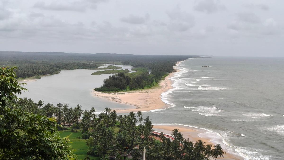 Tourists exploring Karnataka's diverse attractions from ancient temples to modern cities and natural landscapes