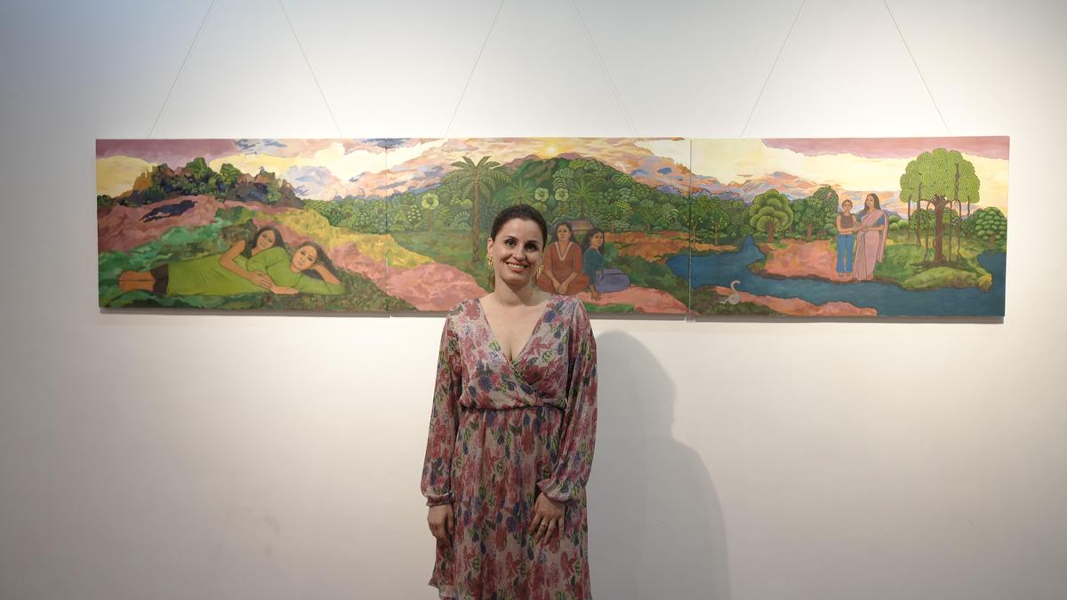 Six-meter white Kerala sari displaying painted portraits of six Malayali women against lush green landscapes