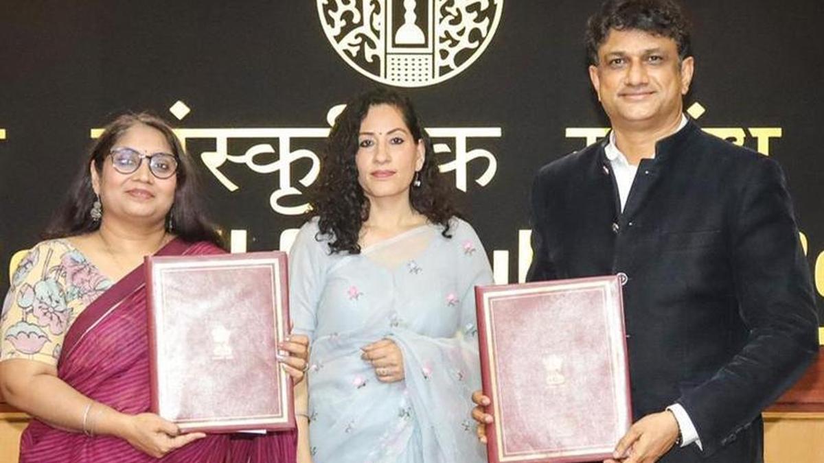 Indian artists performing traditional Karnataka dance on international stage with colorful costumes