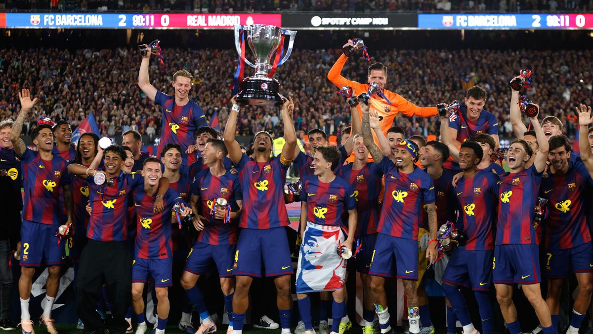 Barcelona players celebrating their 29th LaLiga championship title at packed Camp Nou stadium