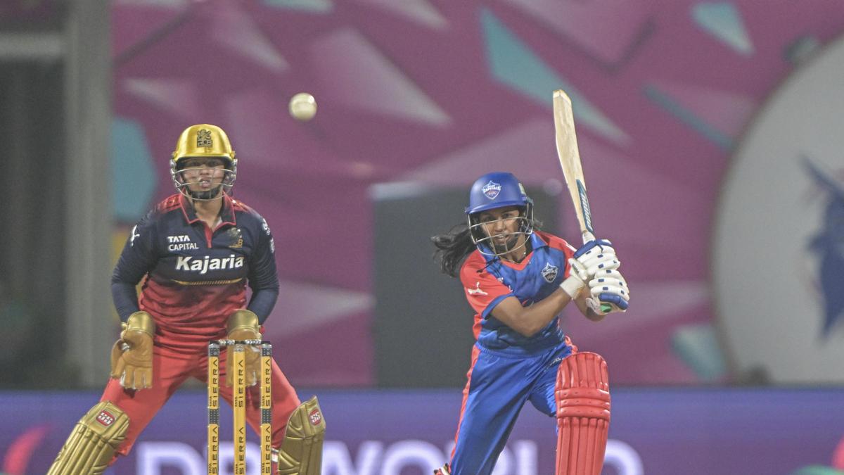 Young cricketer Niki Prasad in blue India jersey celebrating World Cup championship victory