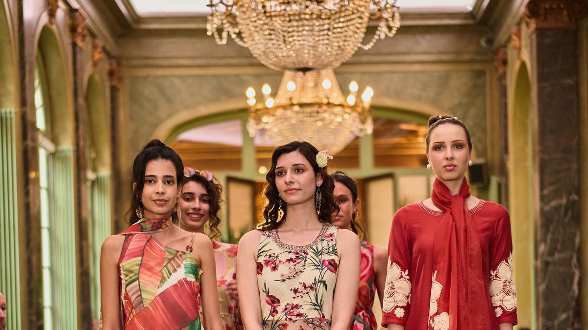 Models wearing WforWoman's fusion collection combining Parisian minimalism with traditional Indian embroidery at Paris Fashion Week