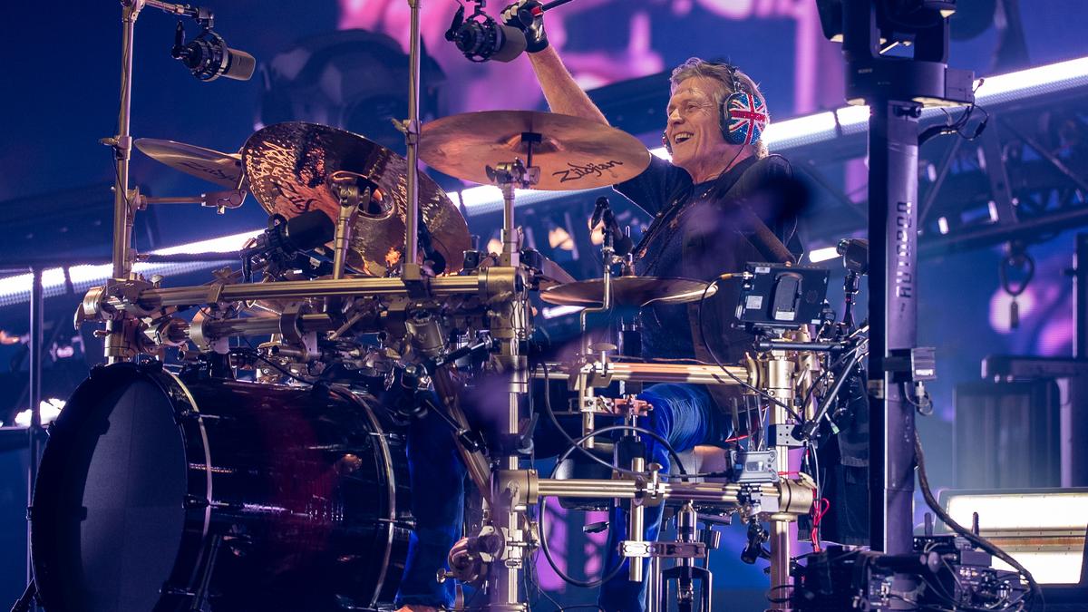 Rick Allen playing drums on stage during Def Leppard's first India tour in Mumbai