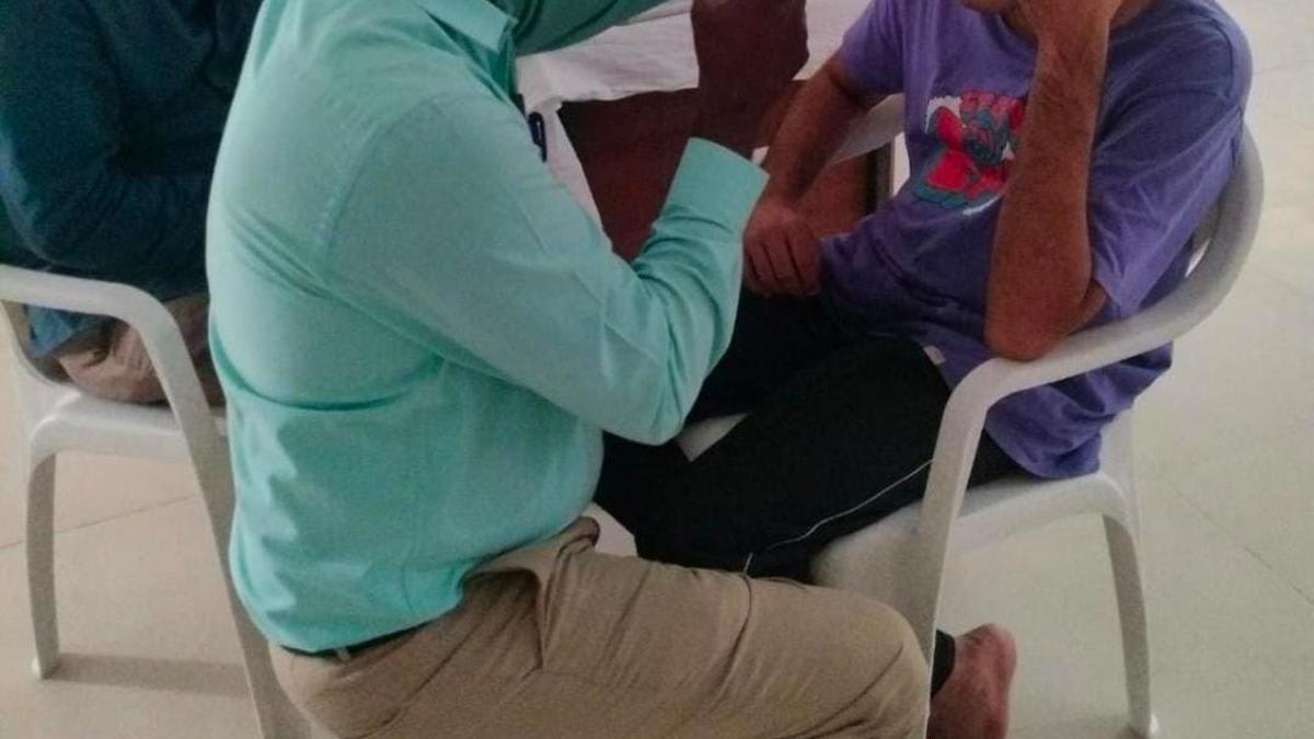 Doctor conducting eye examination for patient in psychiatric rehabilitation center in Chennai