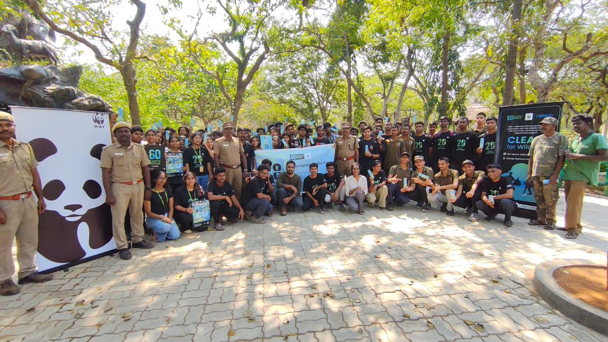 Volunteers collecting trash and cleaning up Guindy National Park in Chennai during Earth Hour 2026