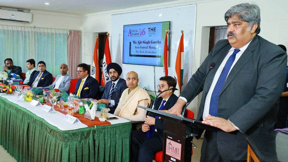 Students in hospitality uniforms receiving awards at annual ceremony in Hyderabad hotel management institute