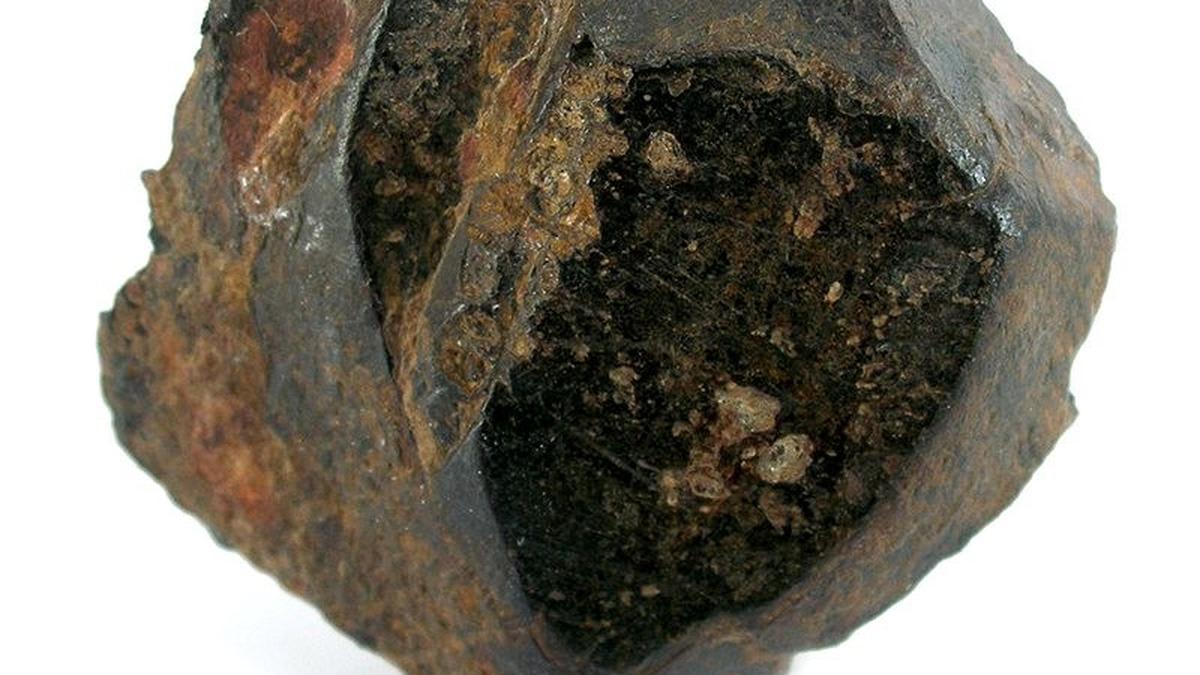 Scientist examining lunar rock samples in high-pressure laboratory equipment at Indian research facility