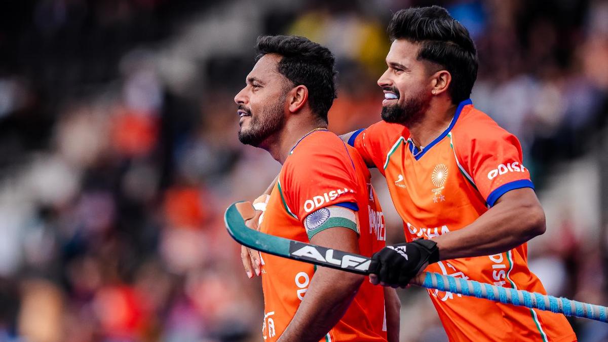 Indian hockey team celebrates during their 5-3 World Cup victory over Pakistan in Rotterdam