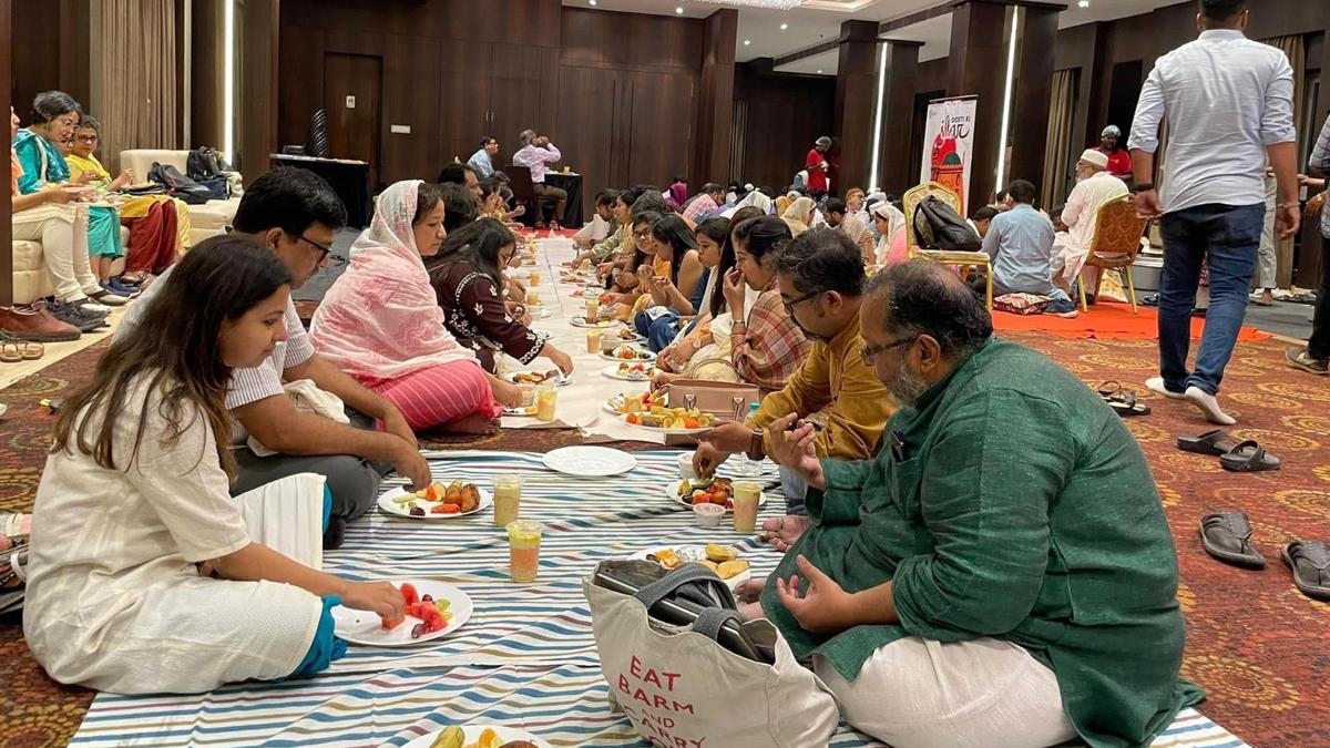Women gathering around table for iftar meal during Ramadan in West Bengal college