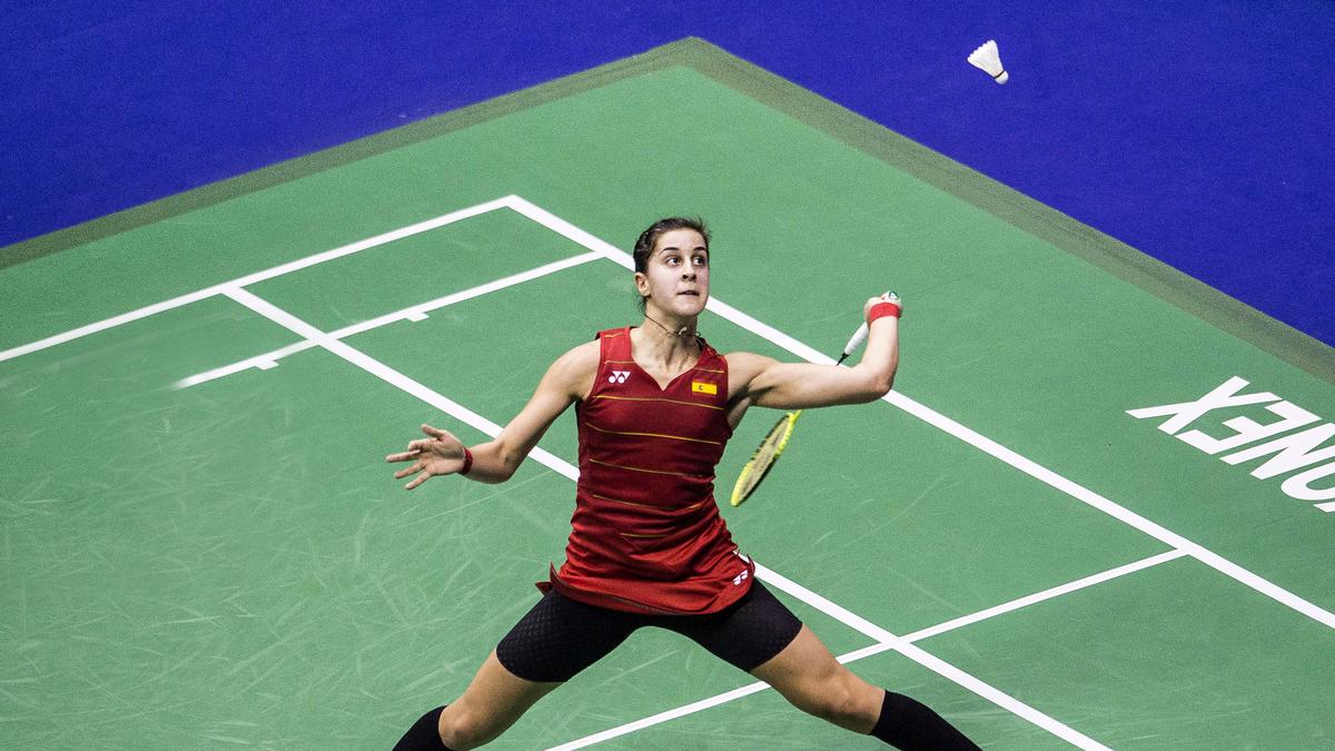 ** Carolina Marín celebrates with Spanish flag after winning Olympic gold medal at Rio 2016