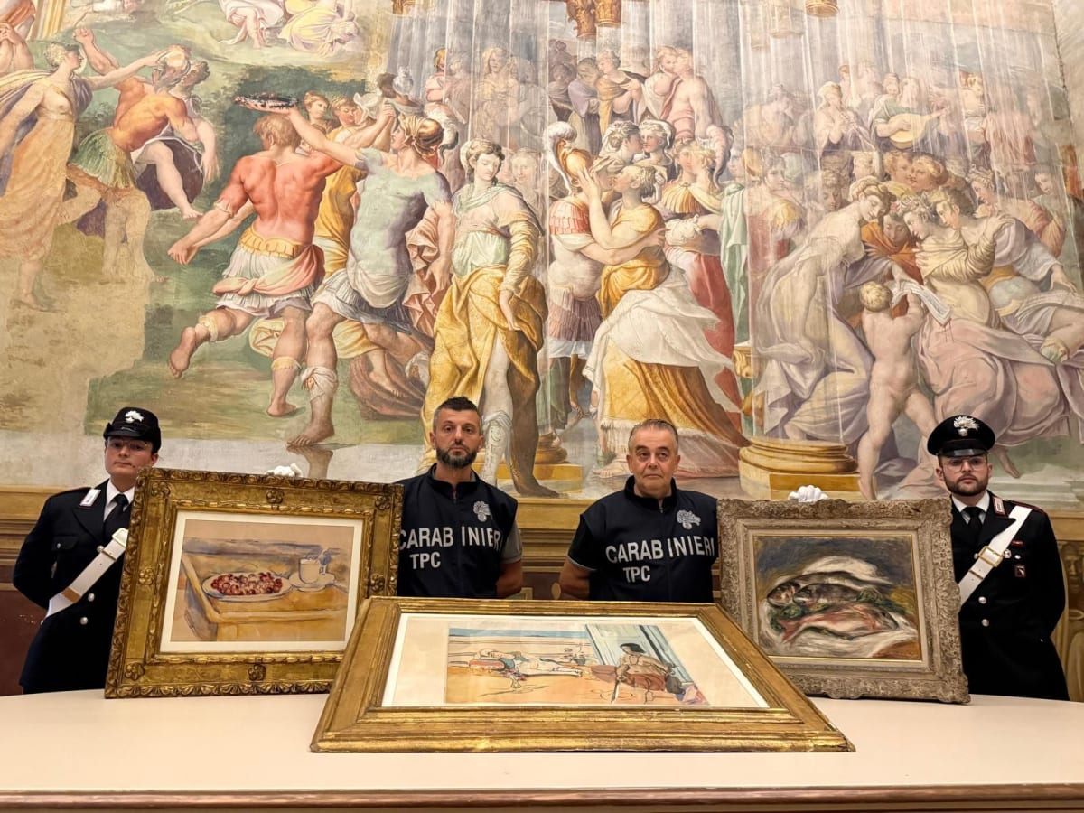 Three recovered masterpiece paintings displayed with Italian police officials standing behind them