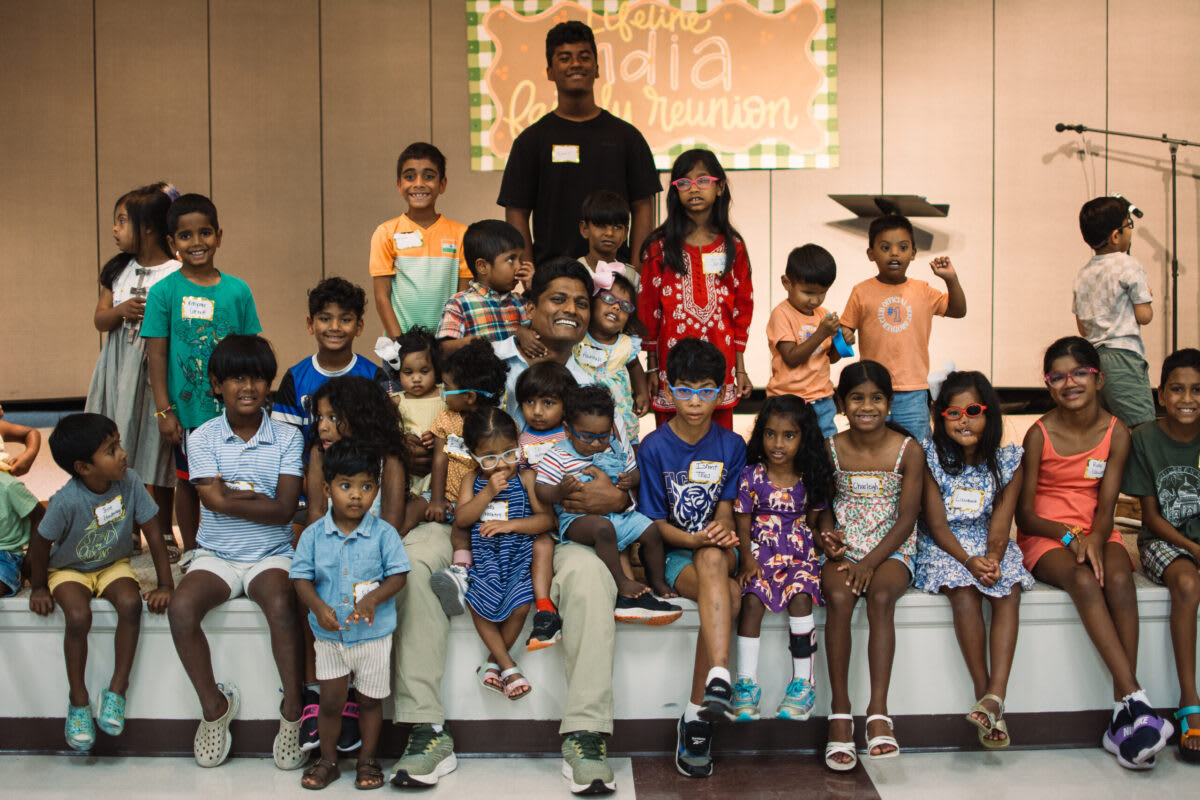 Group of children and families at India adoption reunion with guide Vikram Naidu