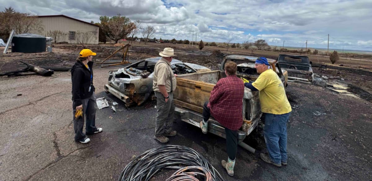 ** Baptist volunteers in safety gear clearing wildfire debris and helping rebuild damaged homes