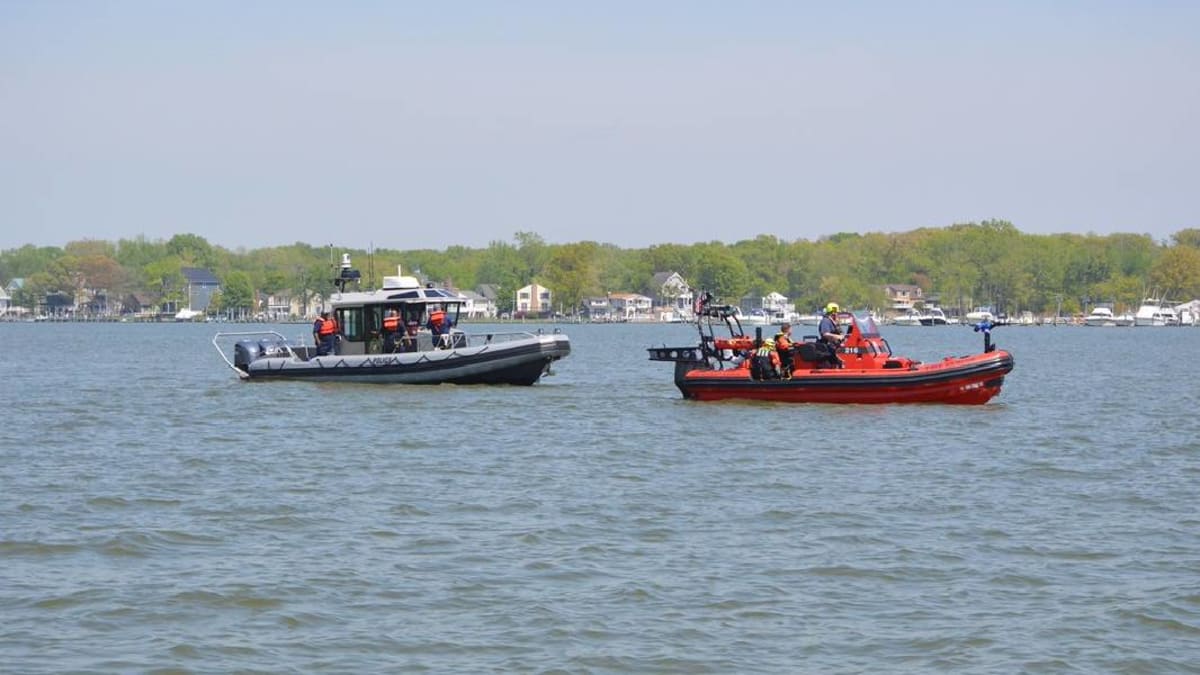 Maryland Natural Resources Police patrol boat alongside rescue vessels on state waterways
