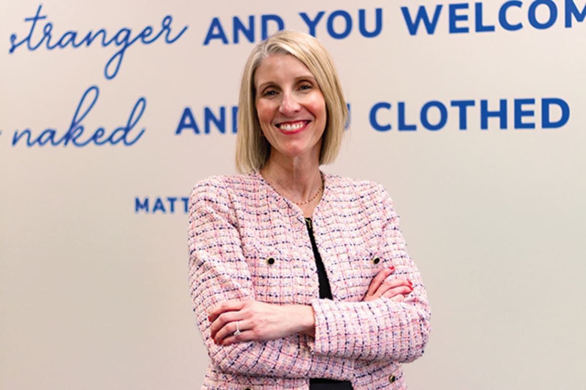 Volunteers sorting donated food items at Catholic Charities food pantry in Kansas