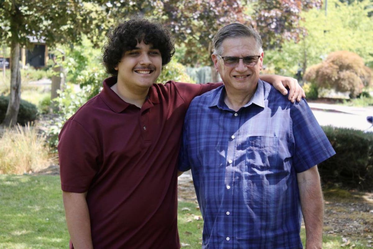 ** Jeff Holmes and teen mentee Cian walking together on Springwater Corridor Trail in Gresham