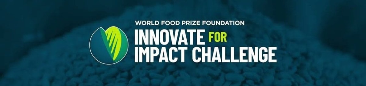 African farmer using modern agricultural technology in green crop field under sunny sky