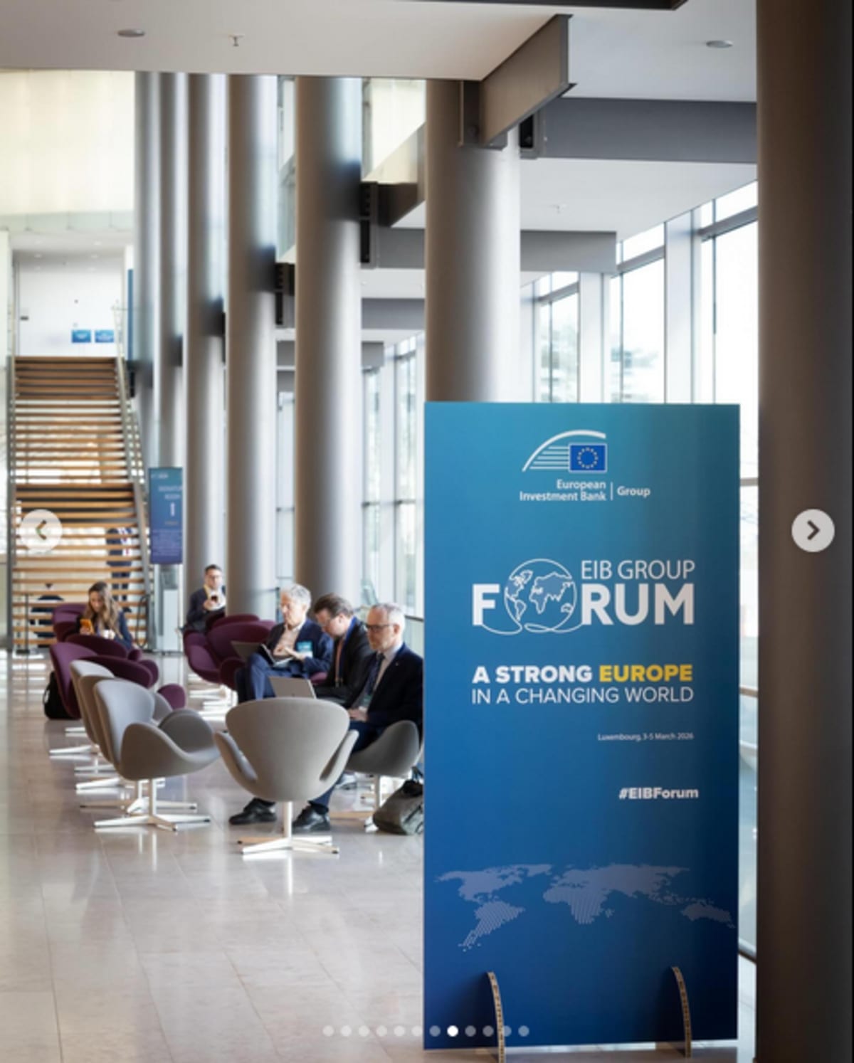 African entrepreneurs collaborating on laptop in modern tech workspace with global connectivity symbols