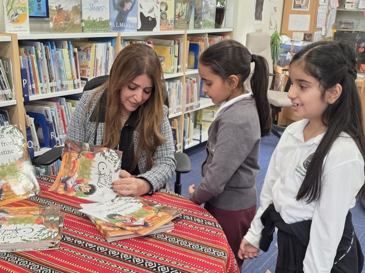 Children with special needs creating colorful paper crowns during interactive book reading session