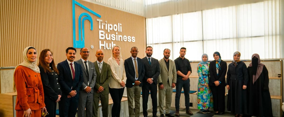 Young Libyan entrepreneurs and program representatives gather at Tripoli Business Hub celebrating startup funding recipients