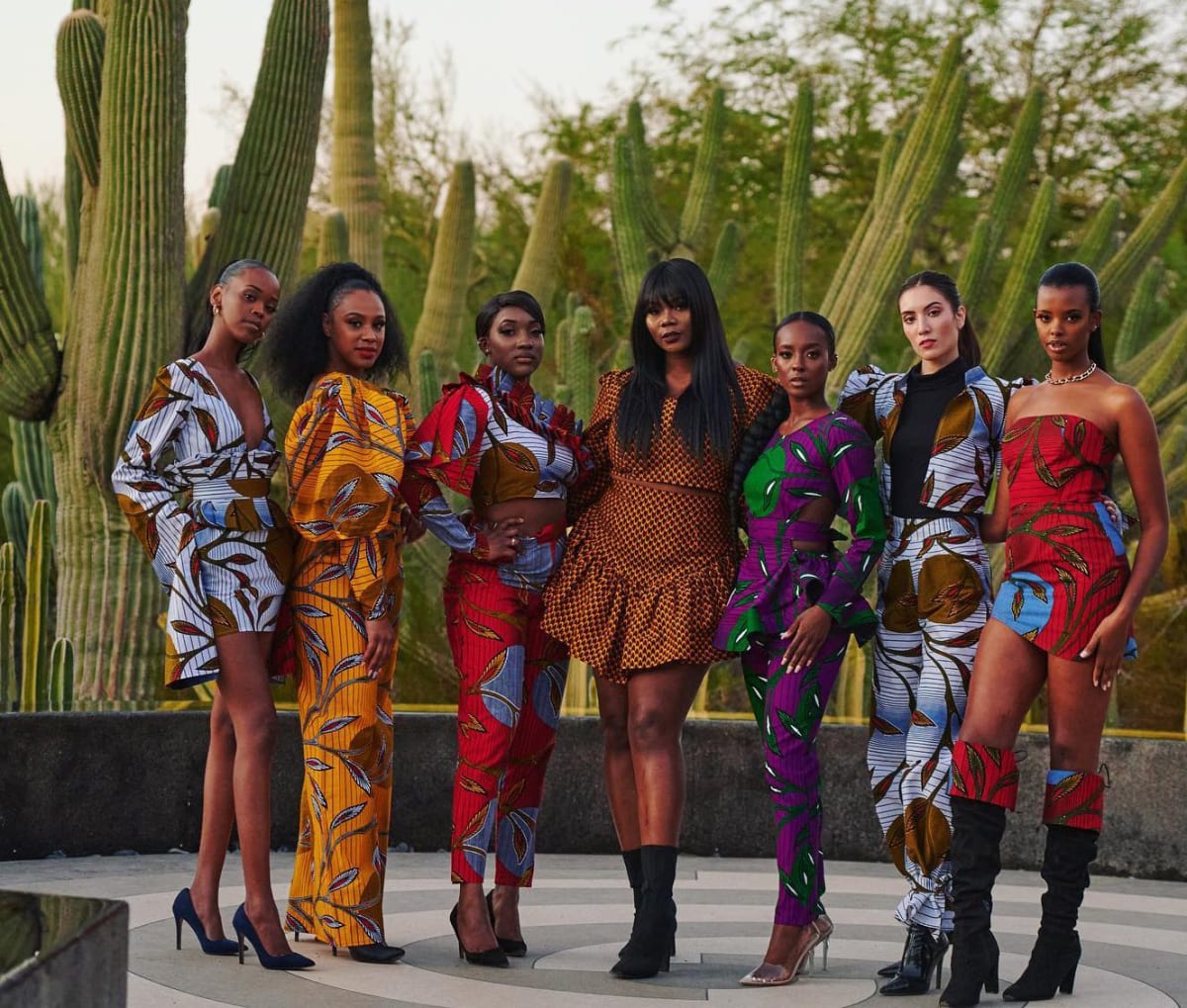 African models wearing vibrant traditional textile designs on fashion runway in Pointe-Noire Congo