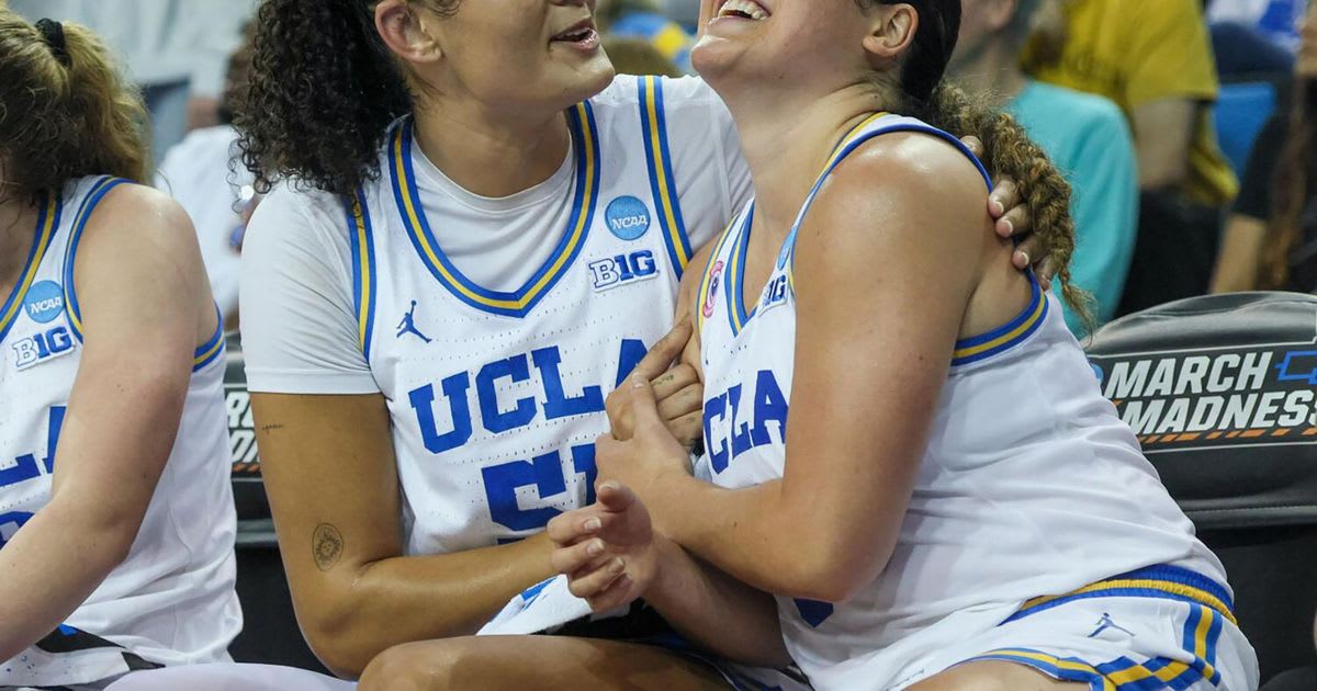 UCLA's Lauren Betts and Charlisse Leger-Walker celebrate on bench during NCAA tournament victory