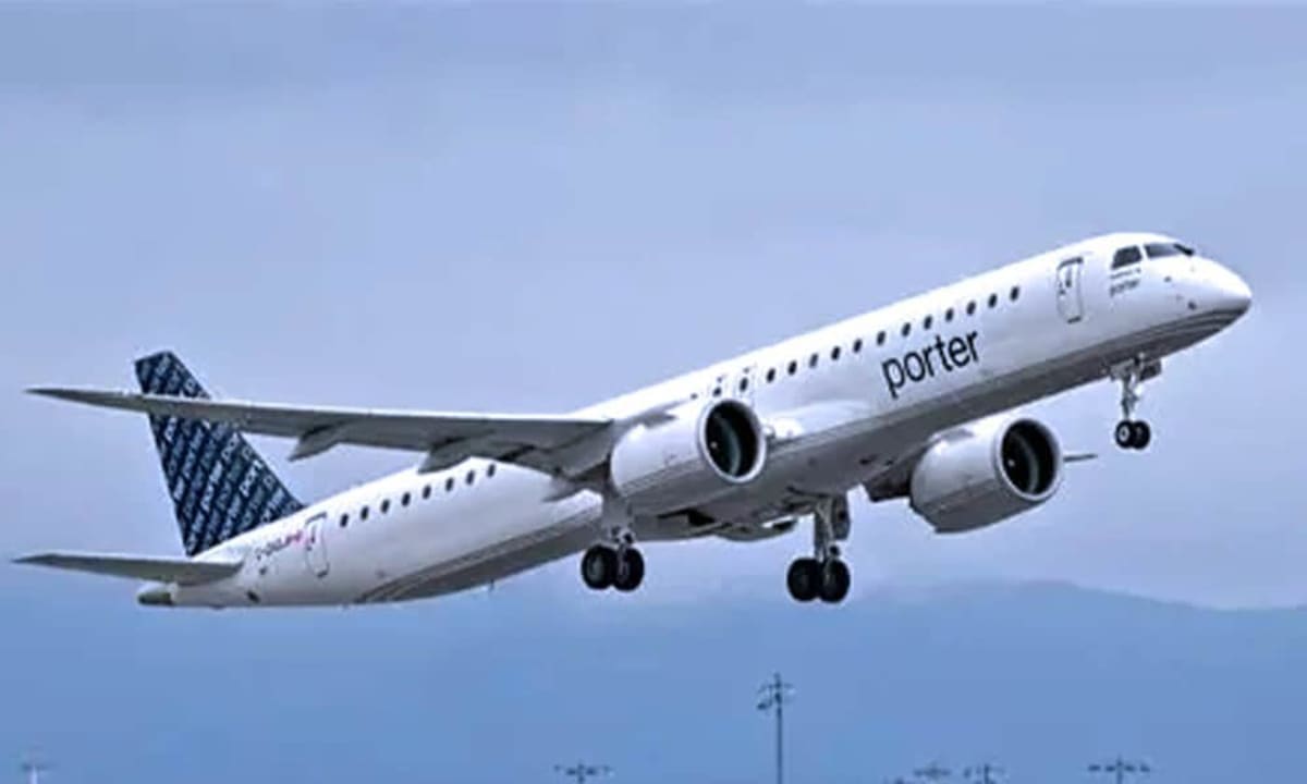 Porter Airlines Embraer jet on tarmac with passengers boarding for tropical destination flight
