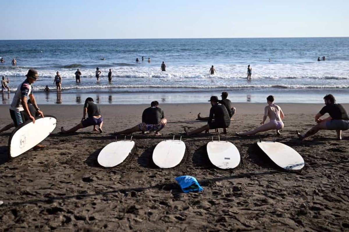 Travelers enjoying El Salvador's Pacific coast beaches and vibrant tourism destinations