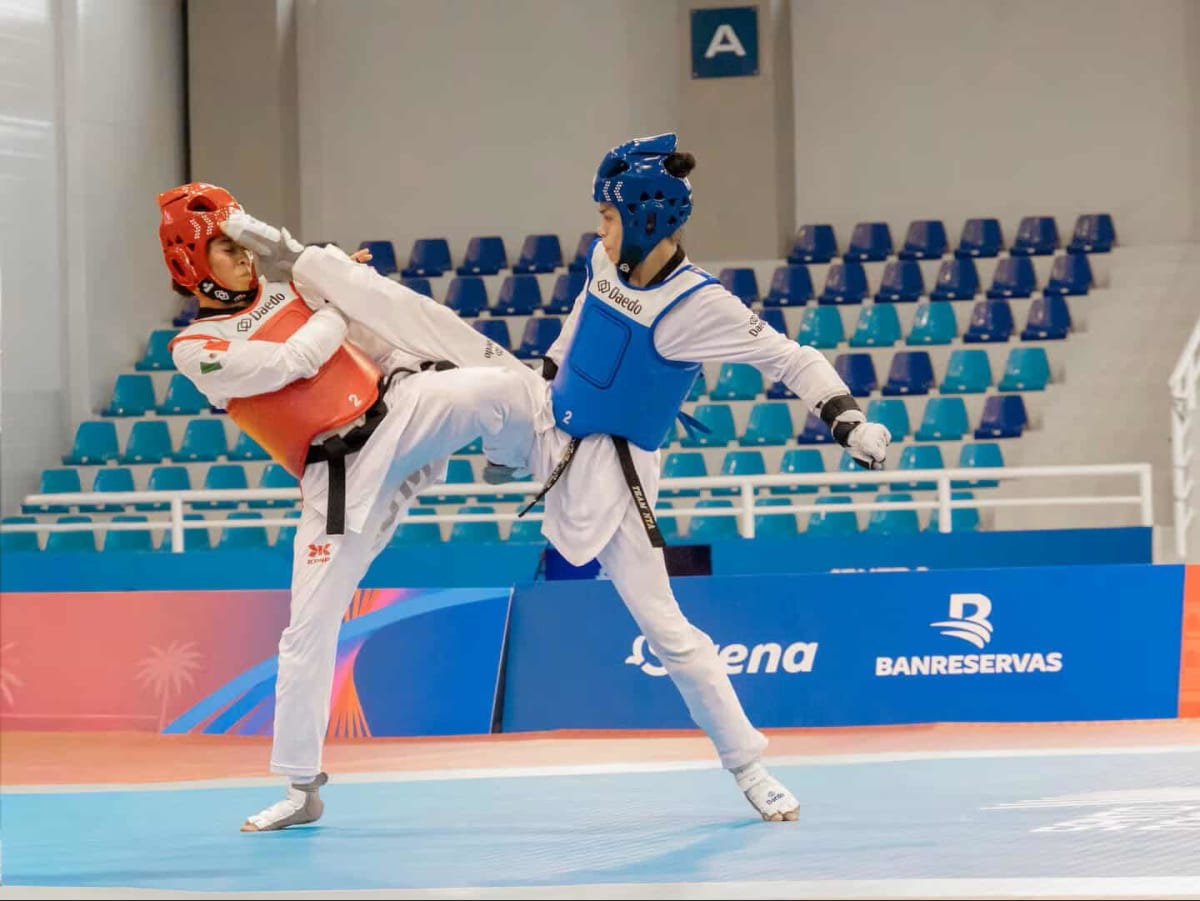 Young female taekwondo athlete Jaycee Bassett competing in protective gear at international tournament